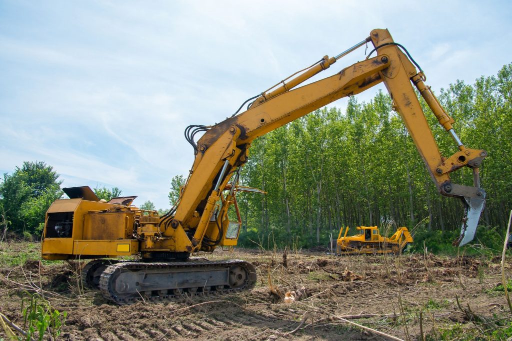 man operating machine to do land clearing